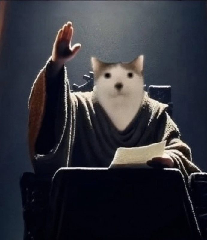 CET in robes raising a hand, issuing a decree